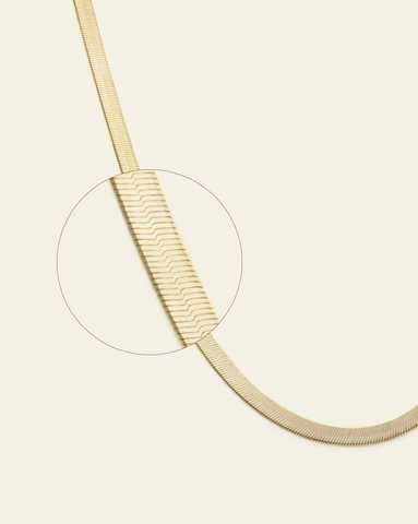 A magnified close up of 4.5mm gold vermeil  herringbone chain.