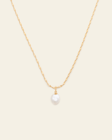 A photo of a Gold Vermeil necklace with a twisted rope chain and a single small baroque pearl pendant on a cream background.