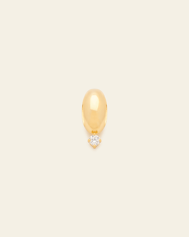 Polished gold bead spacer charm with a single dangling CZ stone, displayed against a neutral background.