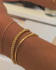 video of 3 vermeil chains on bracelets.