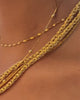 video of 6 gold vermeil chains on models neck.