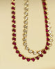 Video of 3mm heart clear and ruby cubic zirconia tennis necklaces sparkling in the sun.