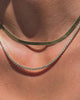 A video of a close up of a model’s neck wearing two necklaces: a Gold Vermeil herringbone chain and a petite bezel set tennis necklace with CZ stones.